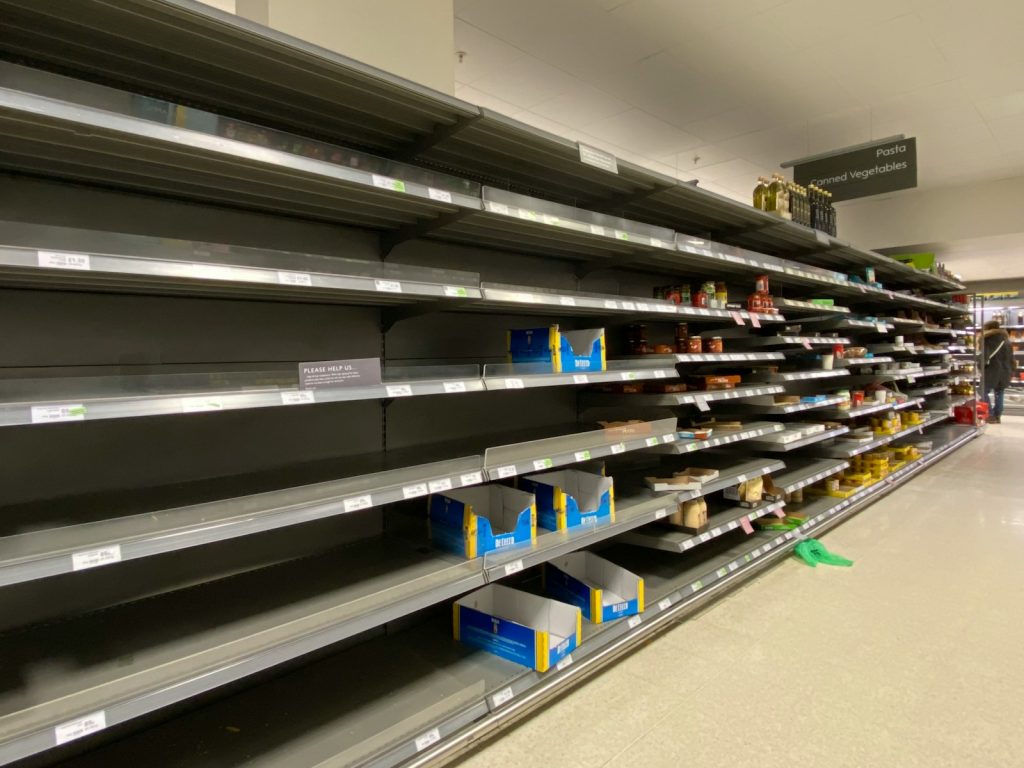 Photo by John Cameron white and blue plastic bottle on shelf
